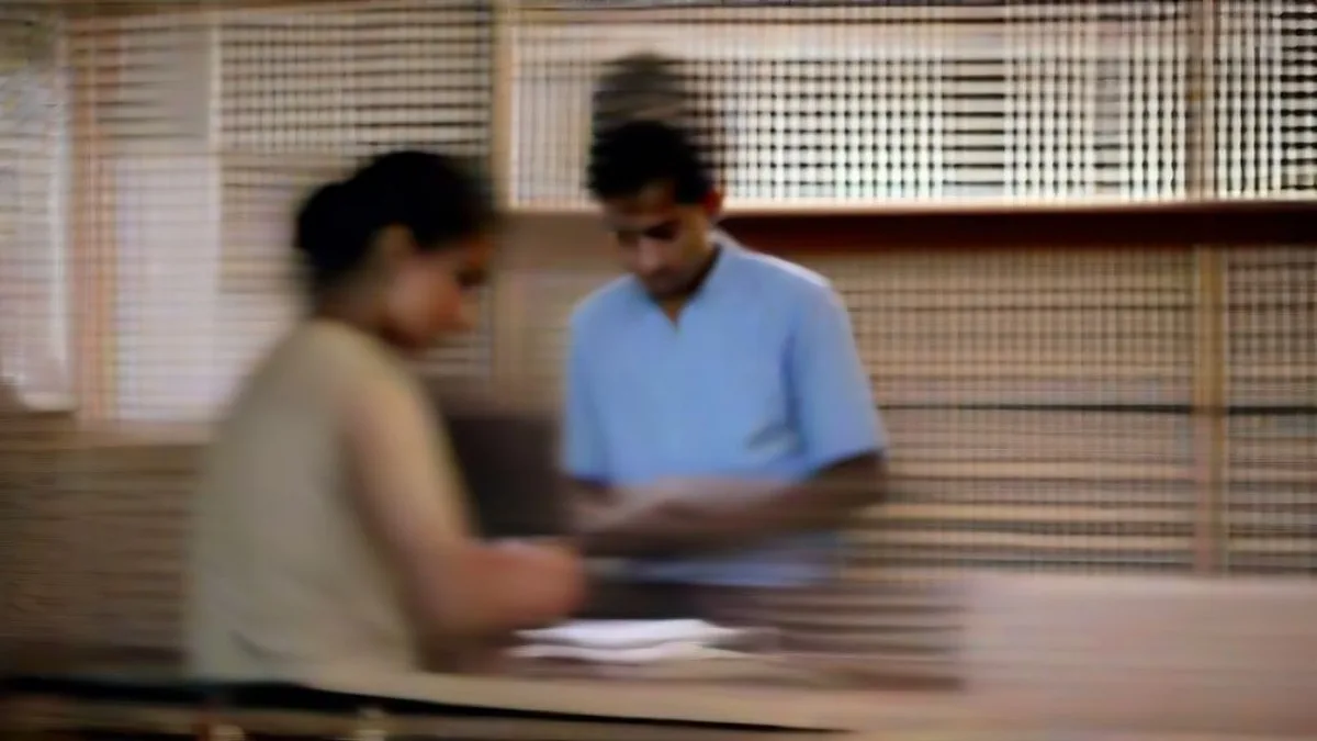 A student reviewing registration documents inside a school classroom.
