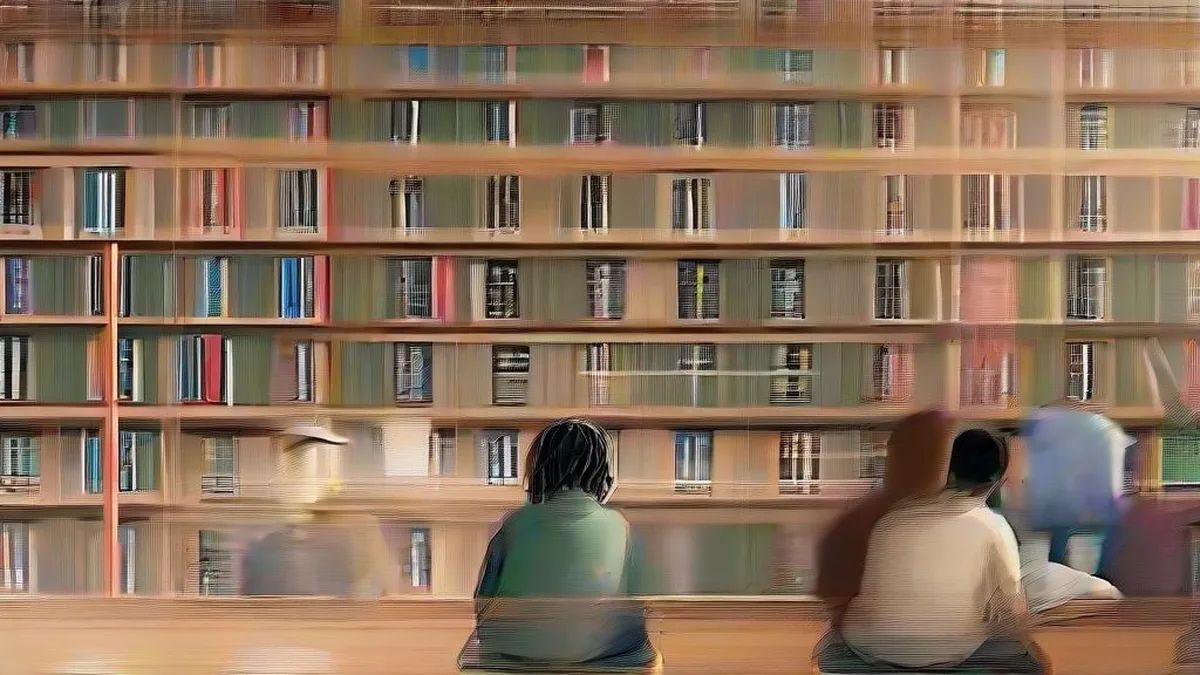 High school students studying textbooks together in a library.