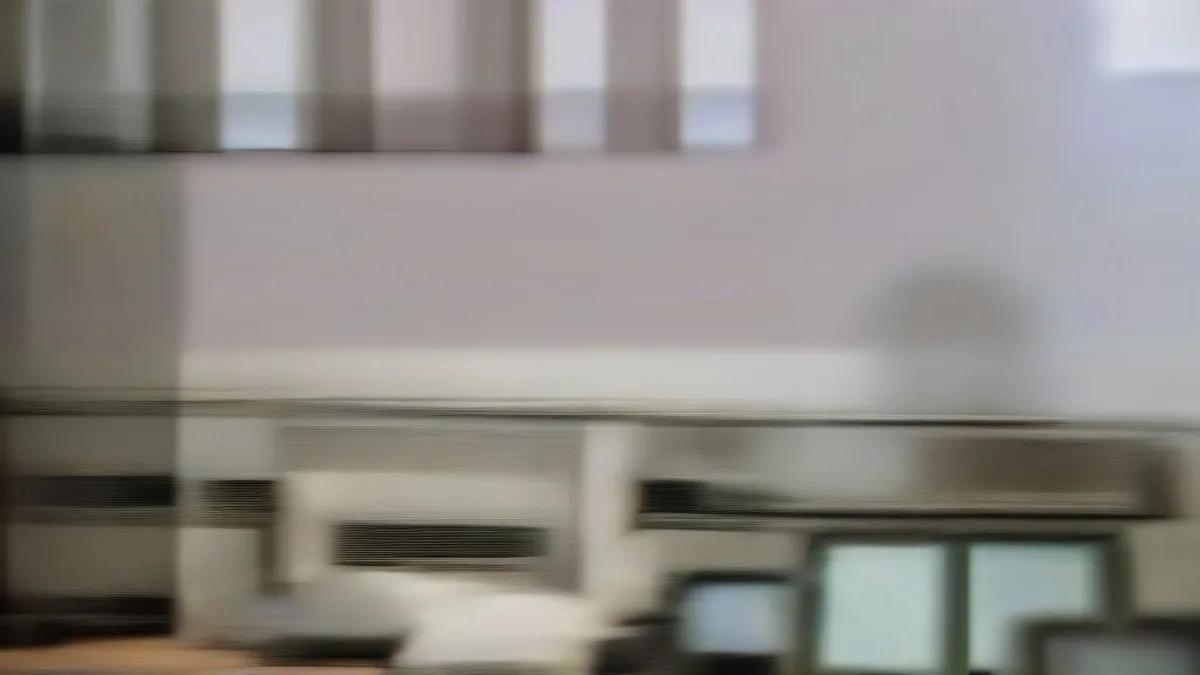Surveillance monitors in a school control room reflecting CCTV camera feeds for exam security.