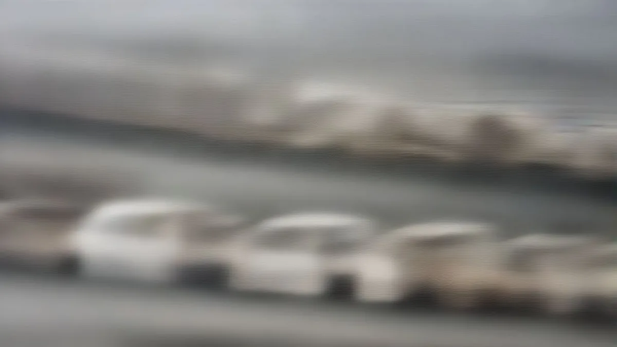 Vehicles moving through smoggy streets in New Delhi during GRAP-1 implementation