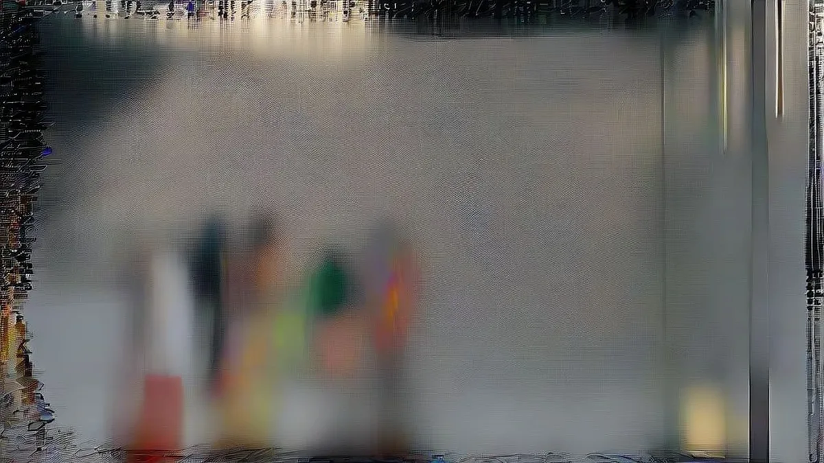 Commuters walking on a wet street in Delhi under overcast skies