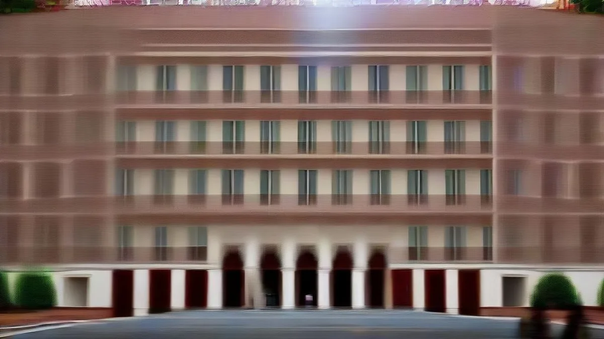 The historic administrative building of the University of Delhi under clear daylight.