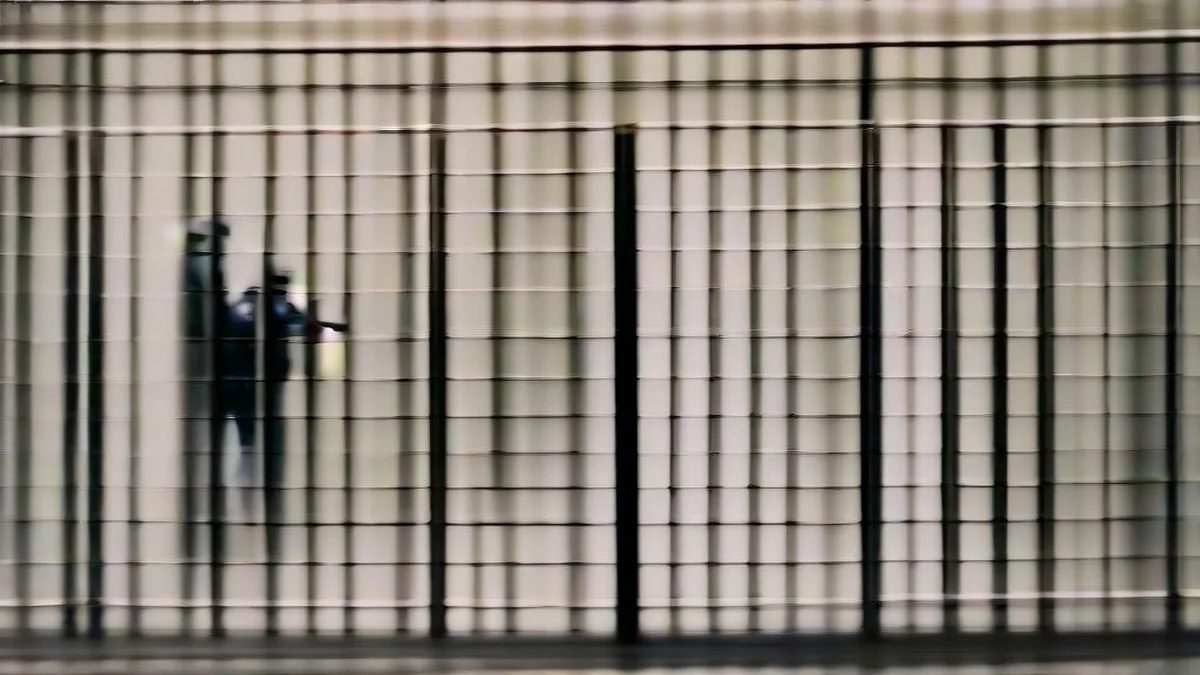 French police officers standing guard near a barricaded street in Paris during a security lockdown.
