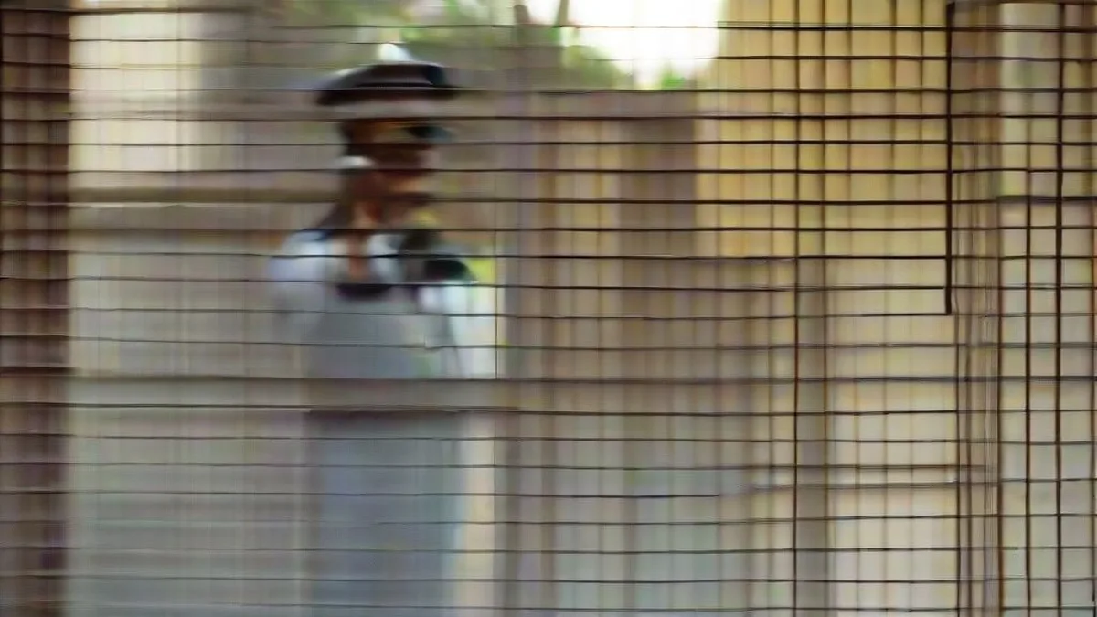 Police officers investigating outside a residential society in Ghaziabad