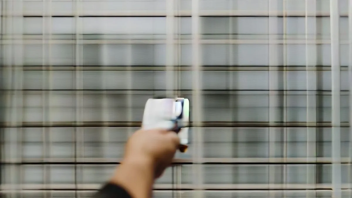 A person holding a smartphone and a SIM card representing upcoming telecom regulations.