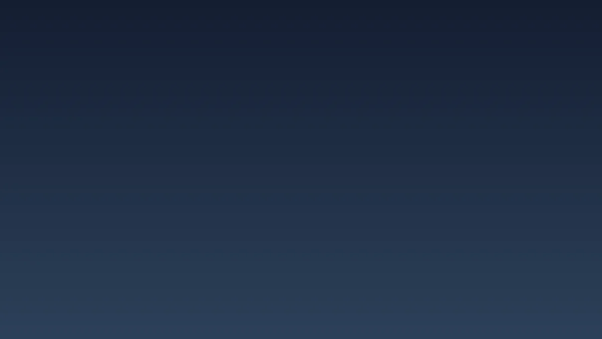 A student working on a laptop in a library environment.