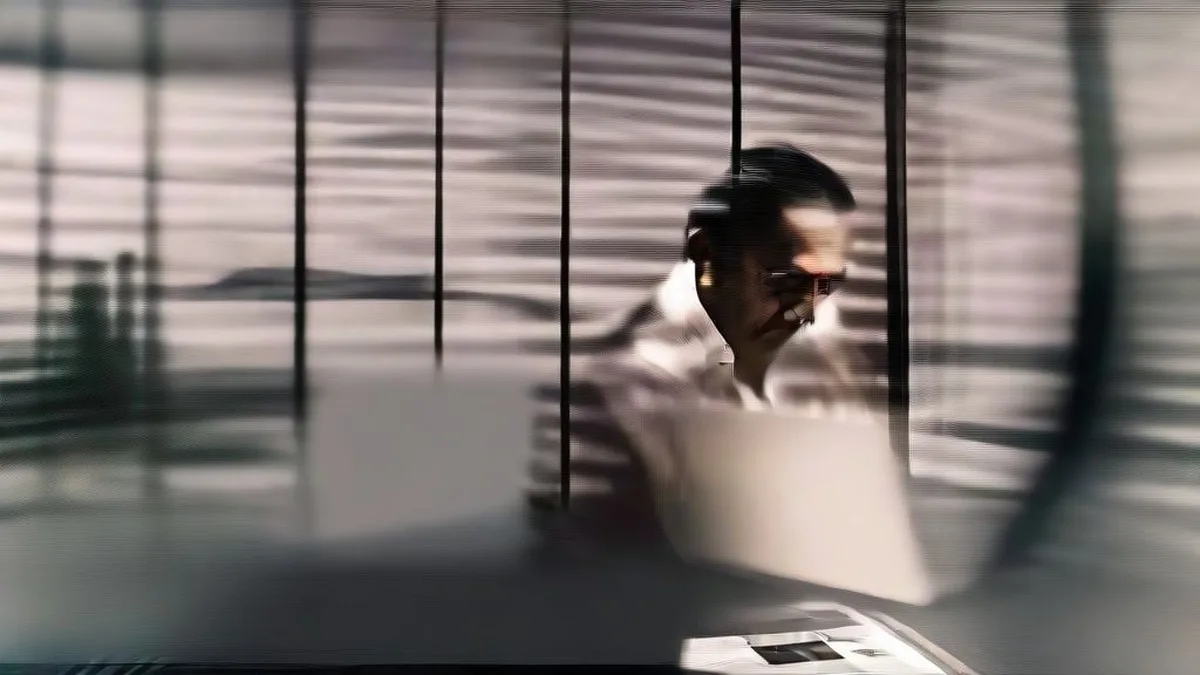 A financial executive reviewing market trends in a modern office.