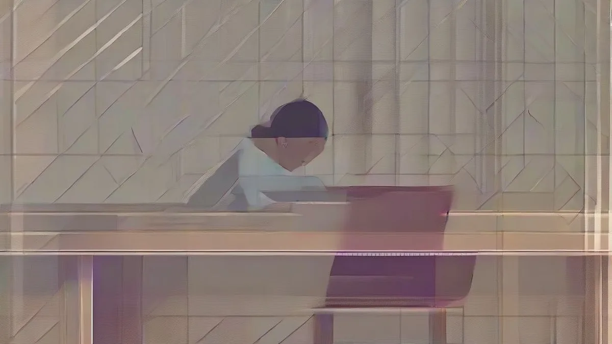 A student using a laptop to view examination registration details.