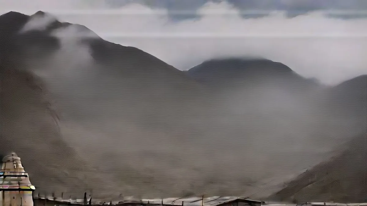 The historic stone architecture of Kedarnath temple against Himalayan peaks