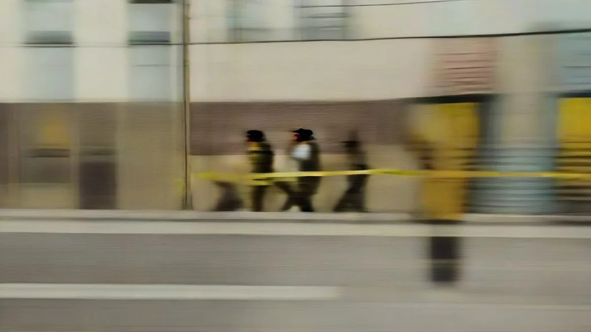 Indian police officers securing a crime scene cordoned off with yellow tape in Lucknow.