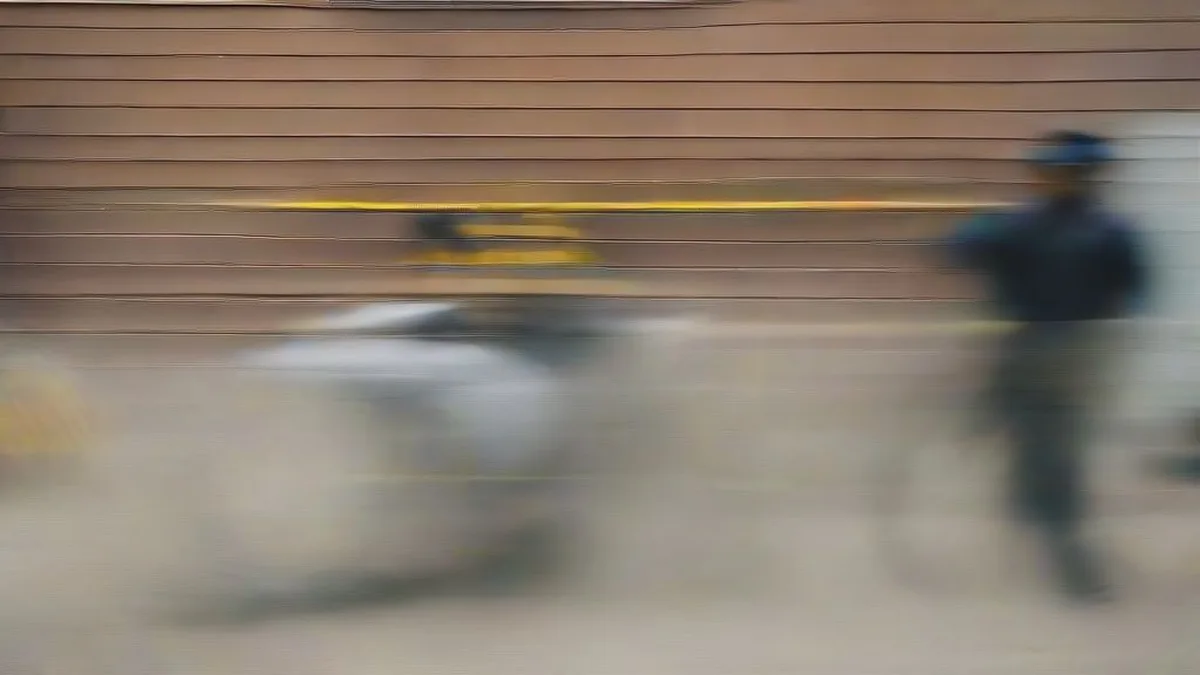 Police officers investigating a crime scene behind yellow tape in Ludhiana