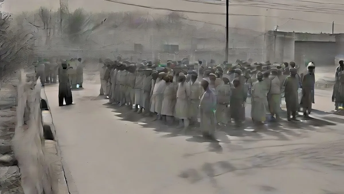 Police officers and protesters gathered on a street in Mansa, Punjab
