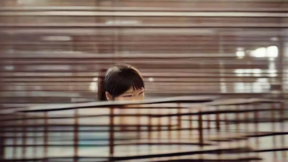 A student working on a laptop during entrance exam preparation