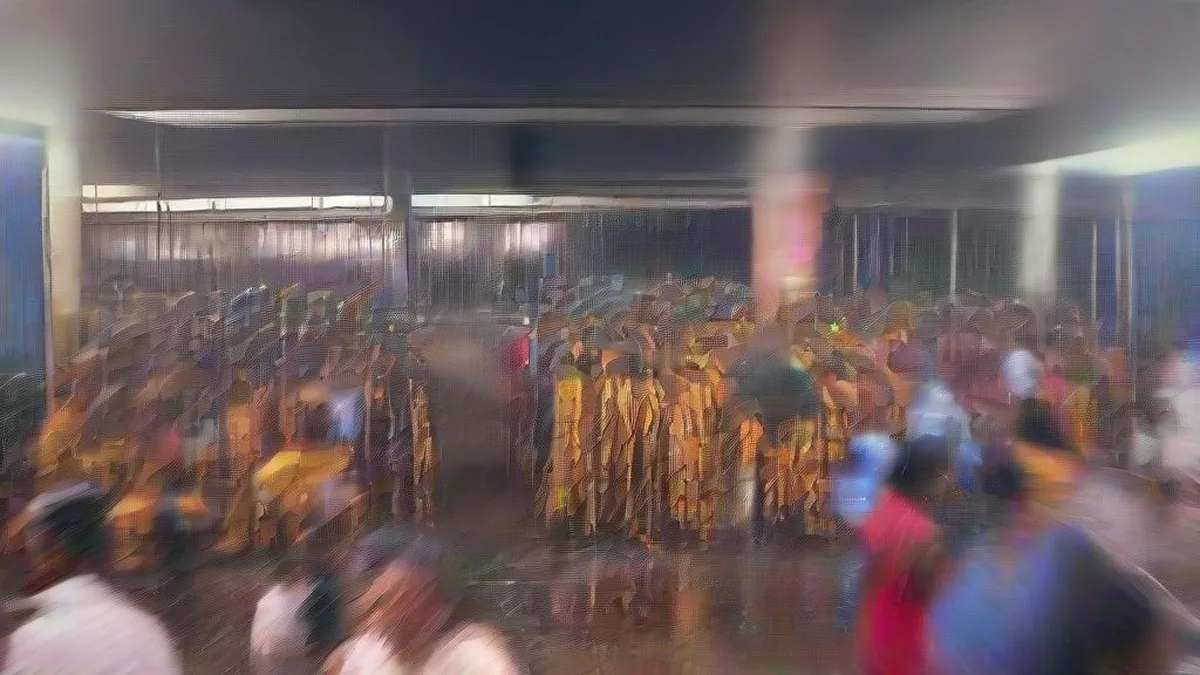 A state transport bus parked at a depot during evening rain in Tamil Nadu
