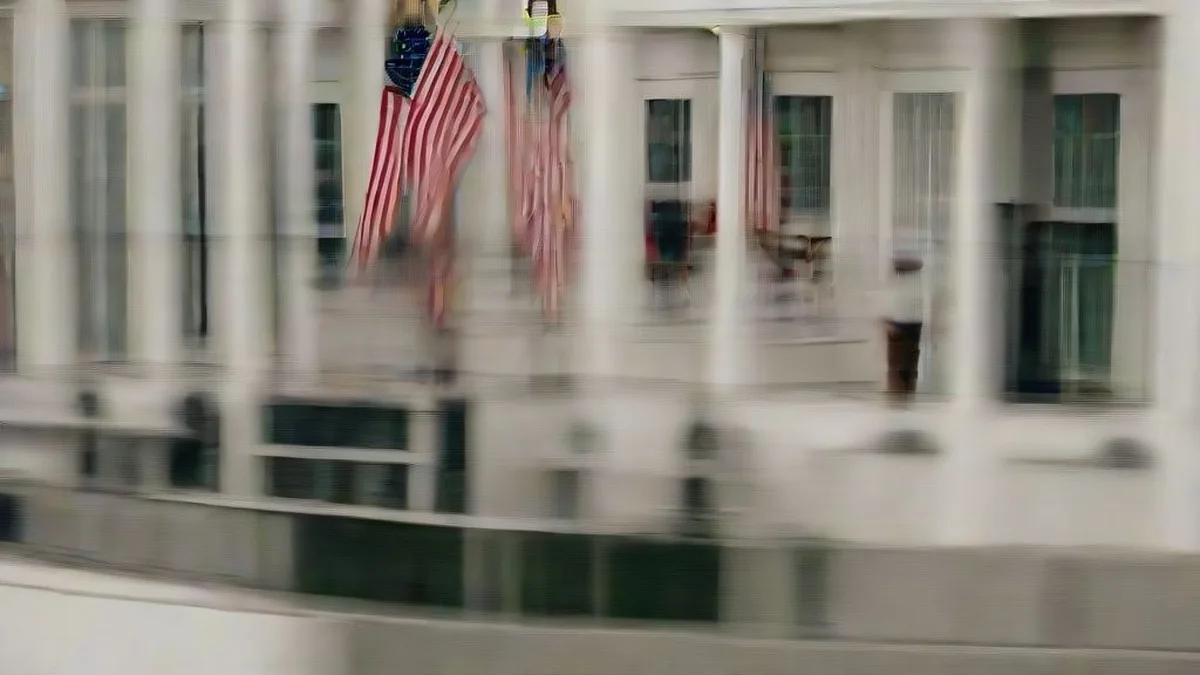 Exterior view of the White House under overcast skies.