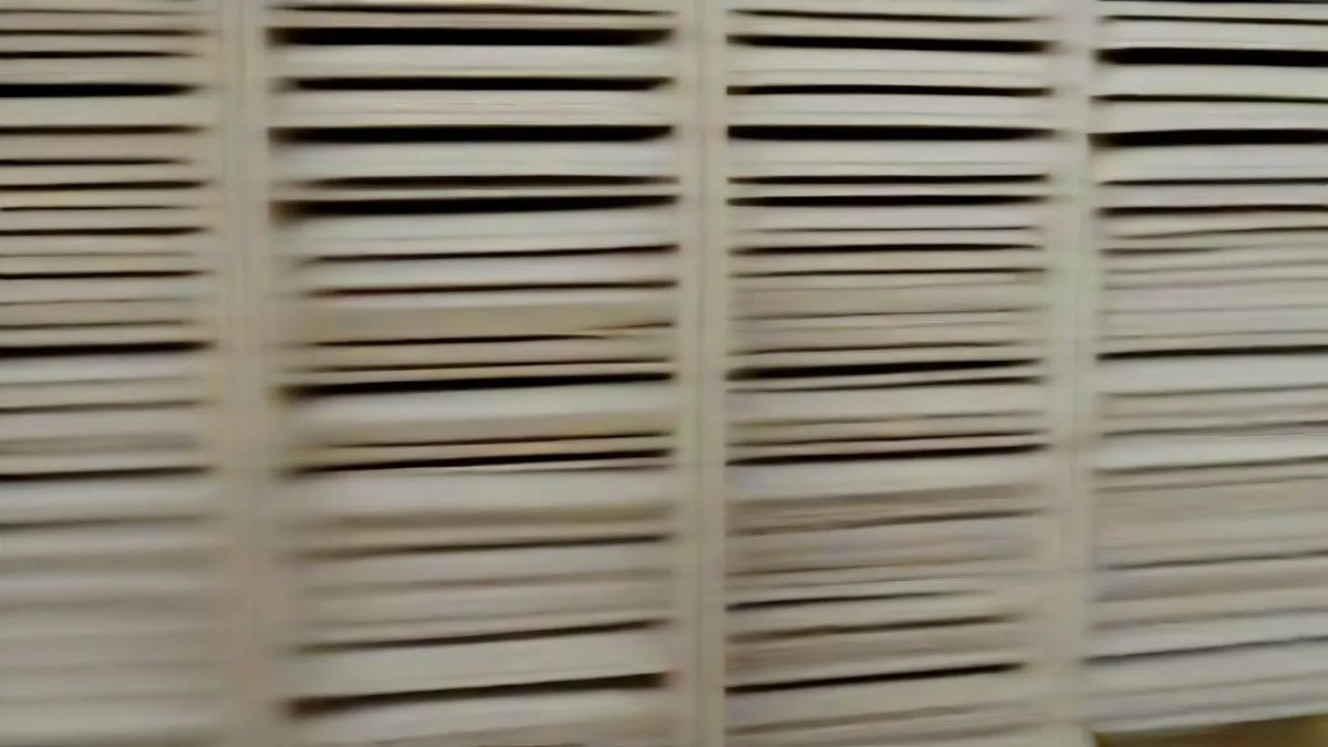 An academic research office with archival files and books representing scientific inquiry.