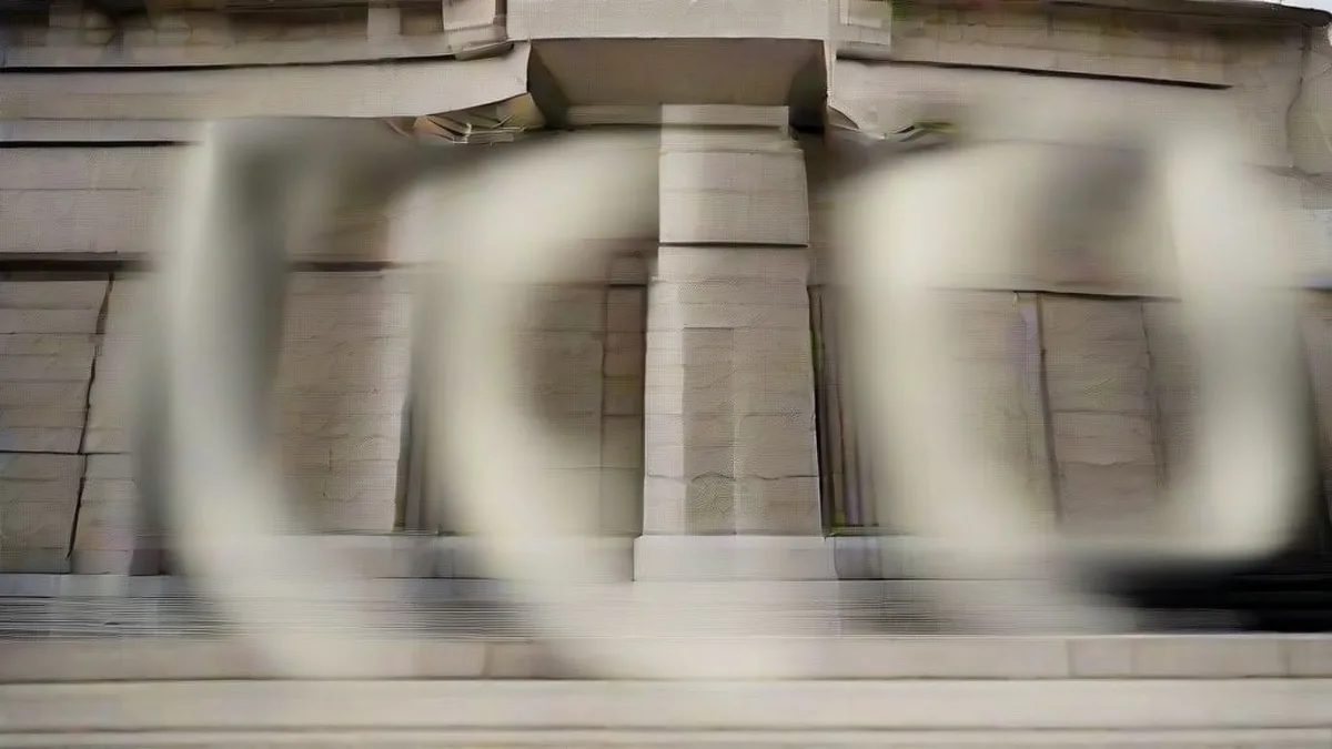 Exterior view of a federal courthouse building in Washington D.C. under overcast skies.